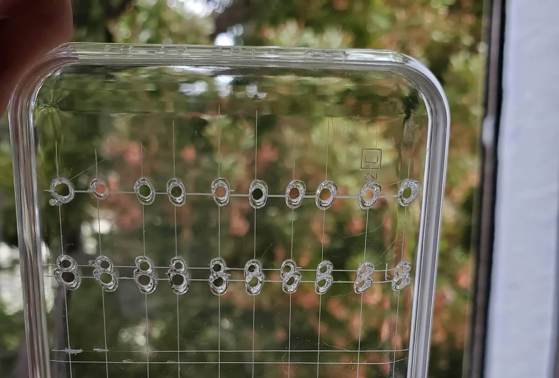 Holes burned into the plastic